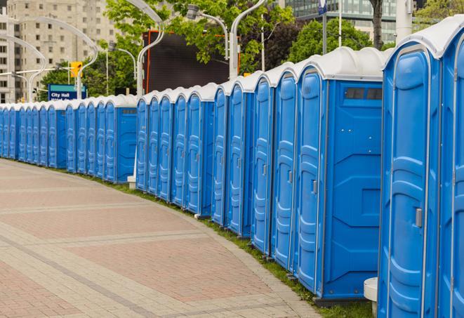 a row of sleek and modern portable restrooms at a special outdoor event in Davenport